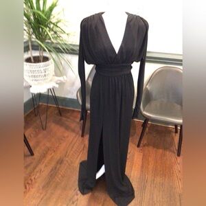 Elegant long sleeve black evening gown with forgiving knit fabric